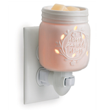 Inspired by the famous home canning jars, this porcelain fragrance warmer glows when lit with the phrase "home sweet home."