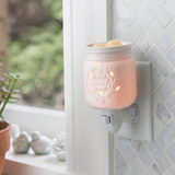 Inspired by the famous home canning jars, this porcelain fragrance warmer glows when lit with the phrase "home sweet home."